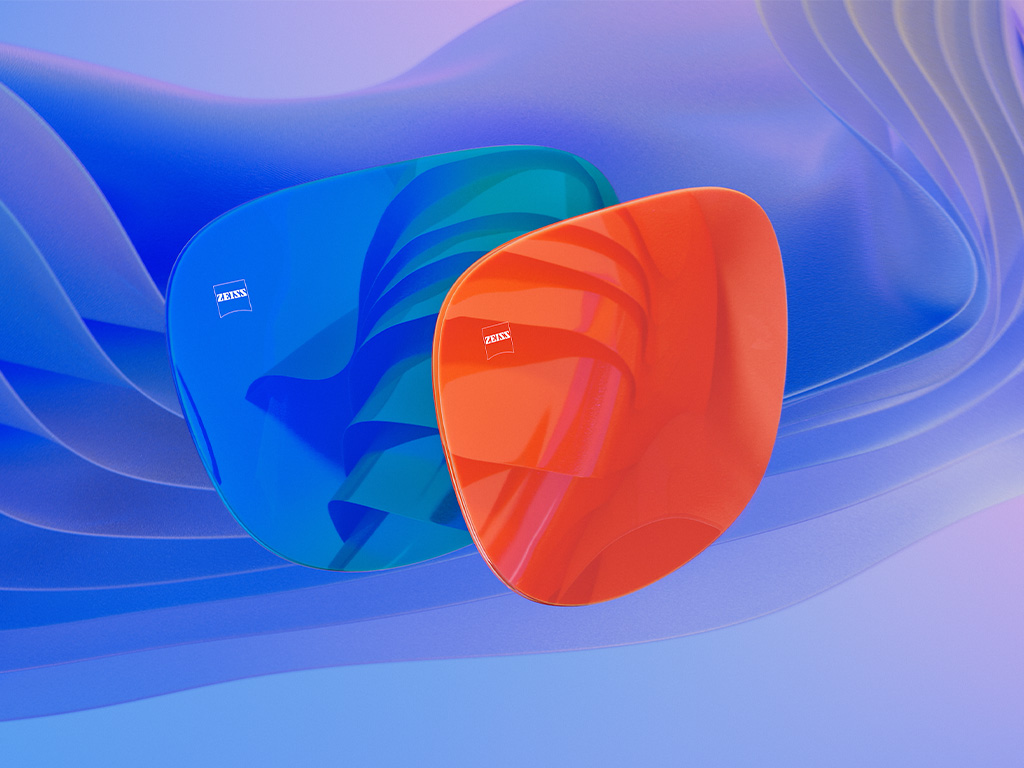 3D CGI -havainnekuva kahdesta aurinkolasilinssistä, joissa on sininen ja oranssi peilipinnoite.