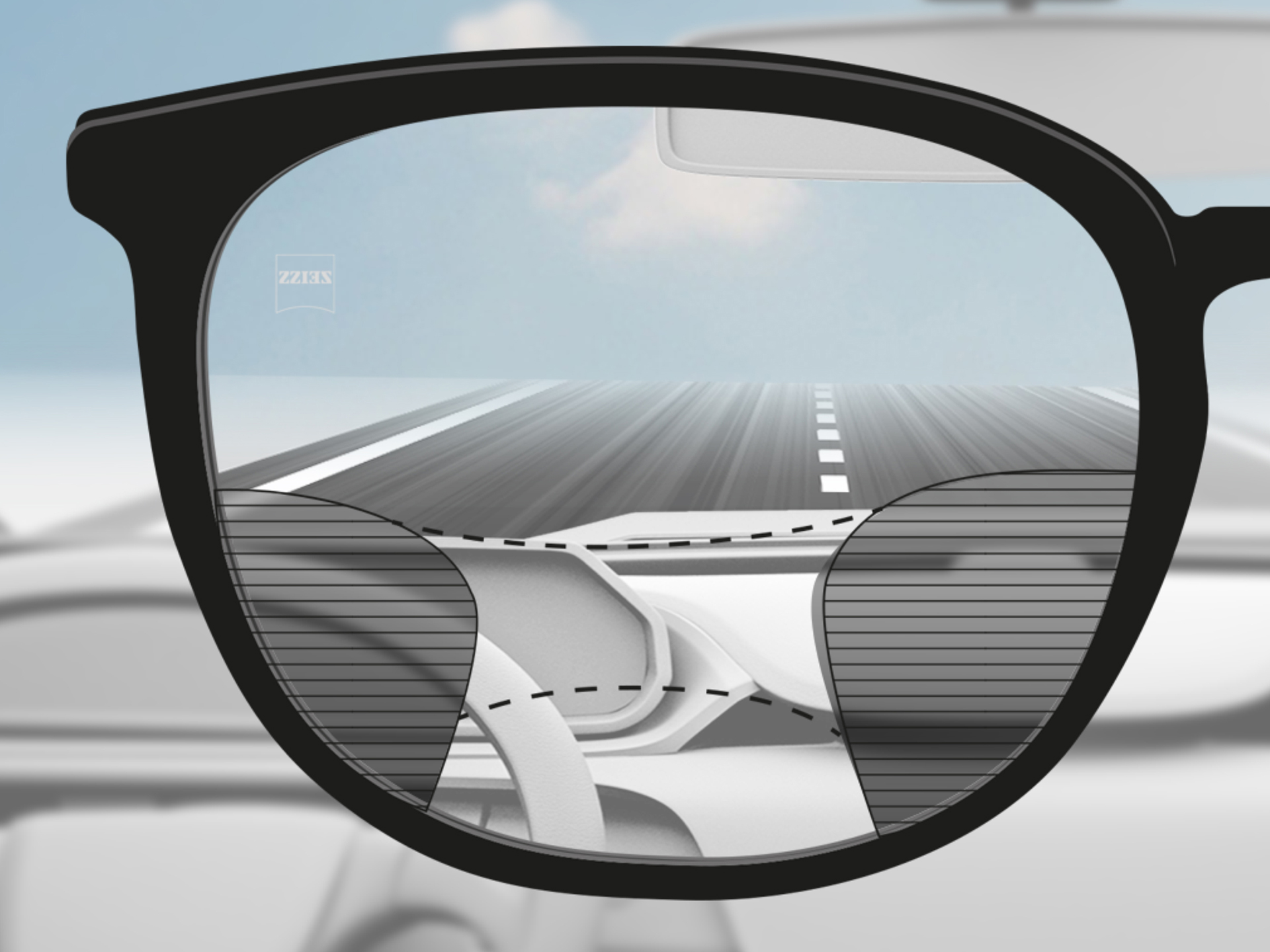 Näkökulmakuva ZEISS Progressive DriveSafe -linssien läpi: näköalueet on mukautettu siten, että kuljettajalla on selkeät näköalueet tiehen ja kojelautaan.