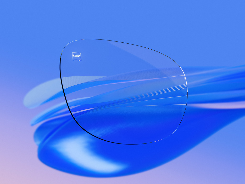 Graafinen 3D-esitys läpinäkyvästä silmälasilinssistä hyvin vähäisin heijastuksin, mikä korostaa sen poikkeuksellista selkeyttä ja optiikan laatua.
