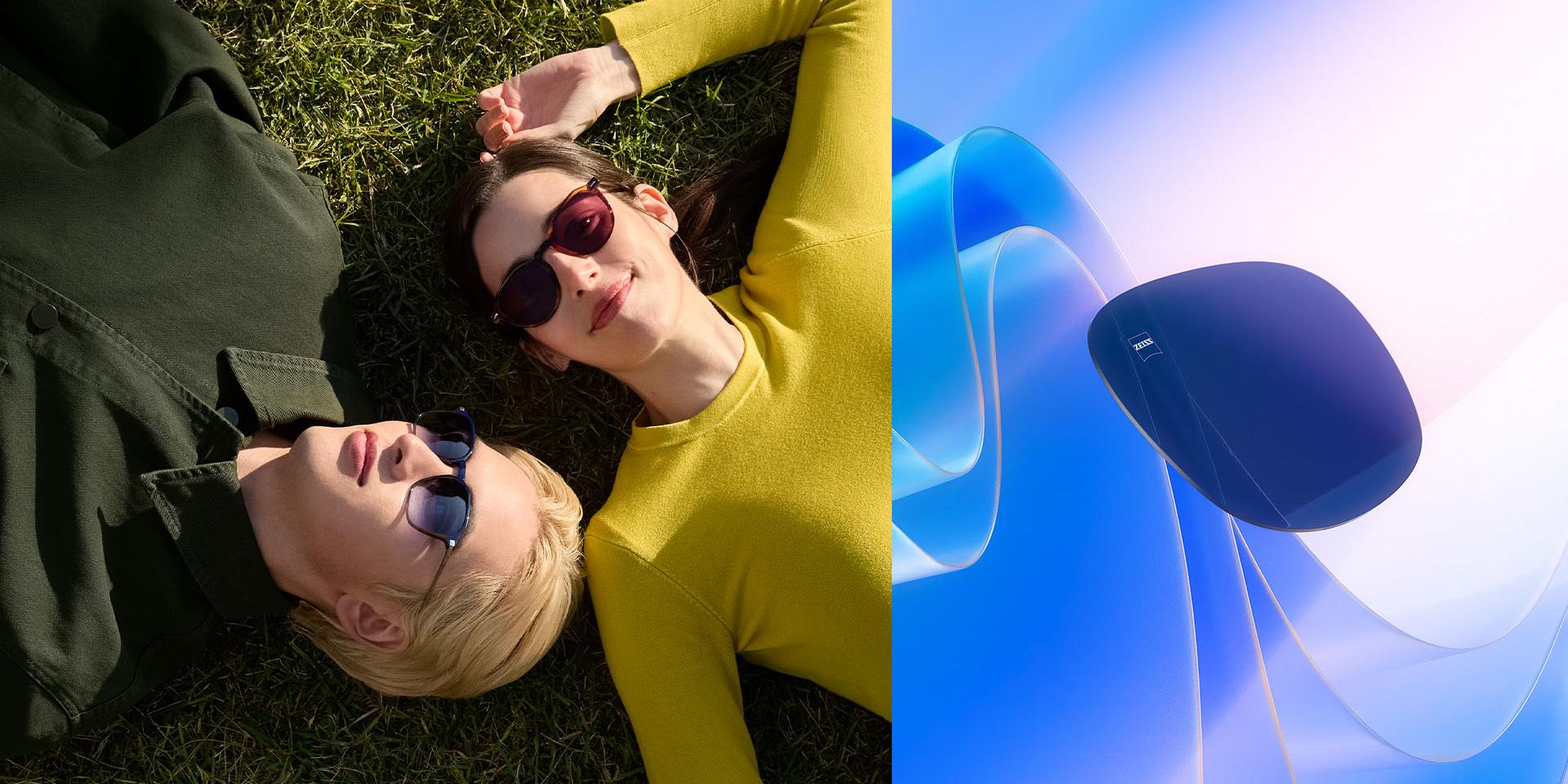 Mies ja nainen, joilla on ZEISS-aurinkolasit vahvuuksilla, rentoutuvat nurmikolla ja katselevat taivaalle. CGI-havainnekuva, jossa värillinen linssi leijuu auringonvaloa vasten ja joka havainnollistaa linssin kykyä pysäyttää UV-säteet